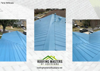 Aerial view of a blue metal roof on a house, highlighting the material and installation quality, with company logo of roofing masters of louisiana.